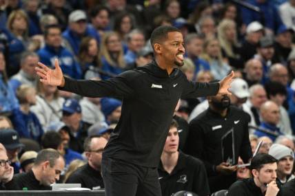 Jan 6, 2024; Omaha, Nebraska, USA; Providence Friars head coach Kim English watches action against the Creighton Bluejays in the first half at CHI Health Center Omaha. Mandatory Credit: Steven Branscombe-USA TODAY Sports
