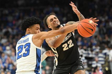 Jan 6, 2024; Omaha, Nebraska, USA; Creighton Bluejays guard Trey Alexander (23) fouls Providence Friars guard Devin Carter (22) on an attempted steal in the first half at CHI Health Center Omaha. Mandatory Credit: Steven Branscombe-USA TODAY Sports