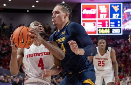 Jan 6, 2024; Houston, Texas, USA; Houston Cougars guard L.J. Cryer (4) drives against West Virginia Mountaineers forward Patrick Suemnick (24) in the second half at Fertitta Center. Mandatory Credit: Thomas Shea-USA TODAY Sports