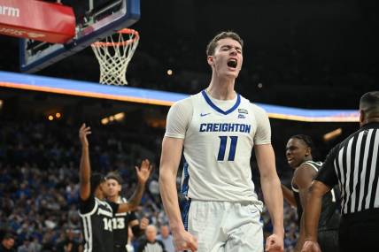 Jan 6, 2024; Omaha, Nebraska, USA; Creighton Bluejays center Ryan Kalkbrenner (11) reacts after scoring and being fouled against the Providence Friars in the second half at CHI Health Center Omaha. Mandatory Credit: Steven Branscombe-USA TODAY Sports