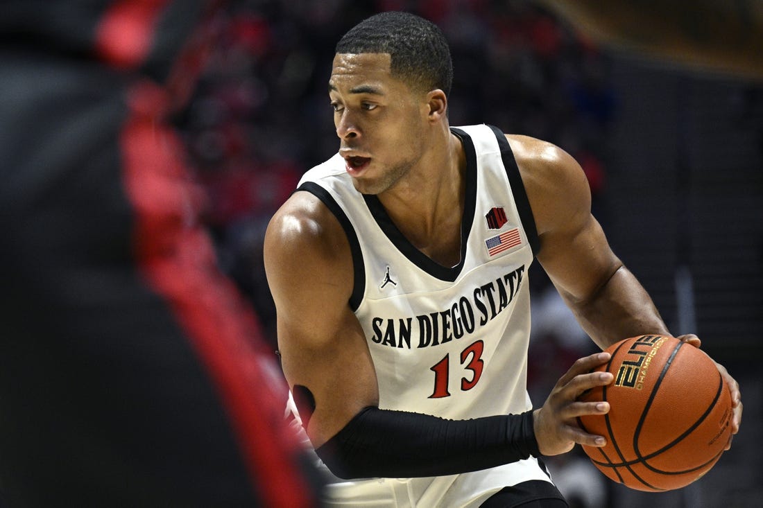 Jan 6, 2024; San Diego, California, USA; San Diego State Aztecs forward Jaedon LeDee (13) controls the ball during the first half against the UNLV Rebels at Viejas Arena. Mandatory Credit: Orlando Ramirez-USA TODAY Sports