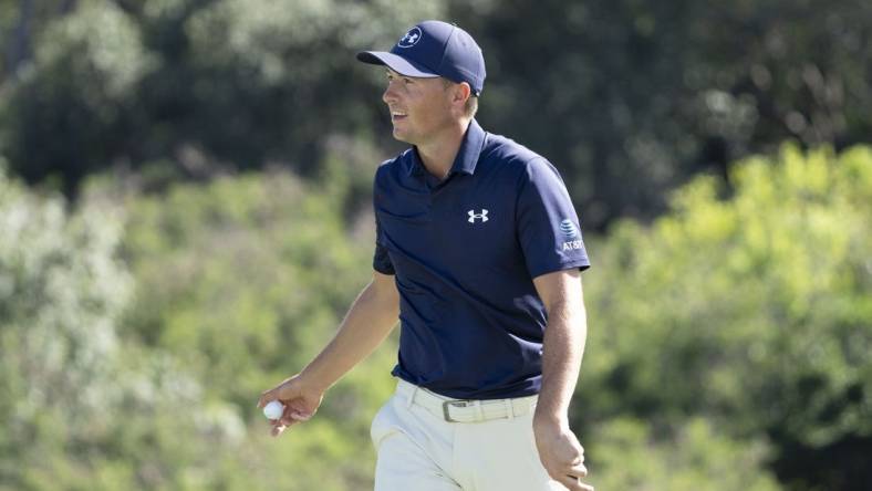 January 6, 2024; Maui, Hawaii, USA; Jordan Spieth smiles after making his putt on the 18th hole during the third round of The Sentry golf tournament at Kapalua Golf - The Plantation Course. Mandatory Credit: Kyle Terada-USA TODAY Sports