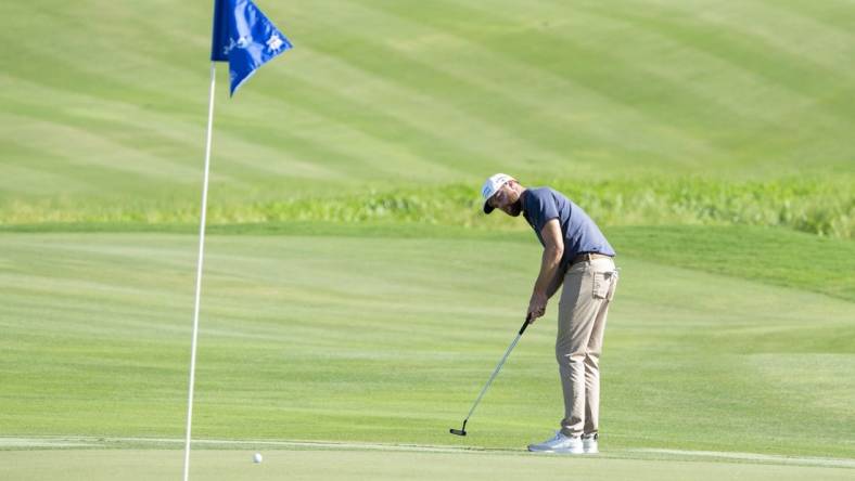 January 6, 2024; Maui, Hawaii, USA; Chris Kirk putts on the 18th hole during the third round of The Sentry golf tournament at Kapalua Golf - The Plantation Course. Mandatory Credit: Kyle Terada-USA TODAY Sports