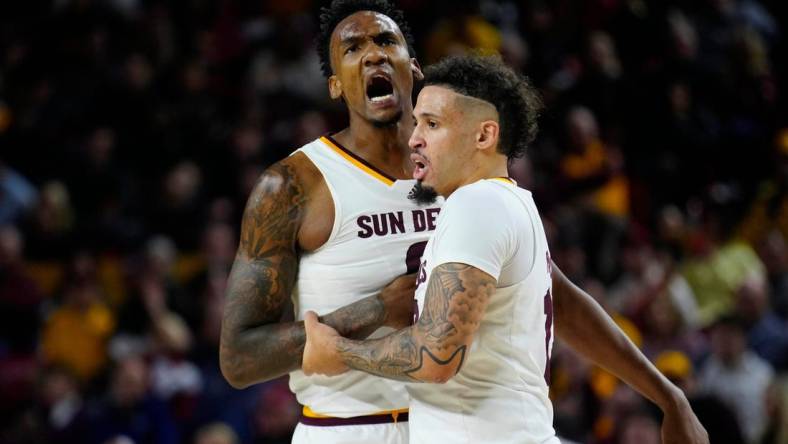 Jan. 6, 2024; Phoenix, Ariz; USA; ASU guard Jose Perez (12) holds back center Shawn Phillips Jr. (9) from arguing with an official during a game against Colorado at Desert Financial Arena.