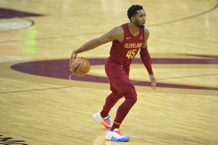 Jan 7, 2024; Cleveland, Ohio, USA; Cleveland Cavaliers guard Donovan Mitchell (45) dribbles the ball in the first quarter against the San Antonio Spurs at Rocket Mortgage FieldHouse. Mandatory Credit: David Richard-USA TODAY Sports