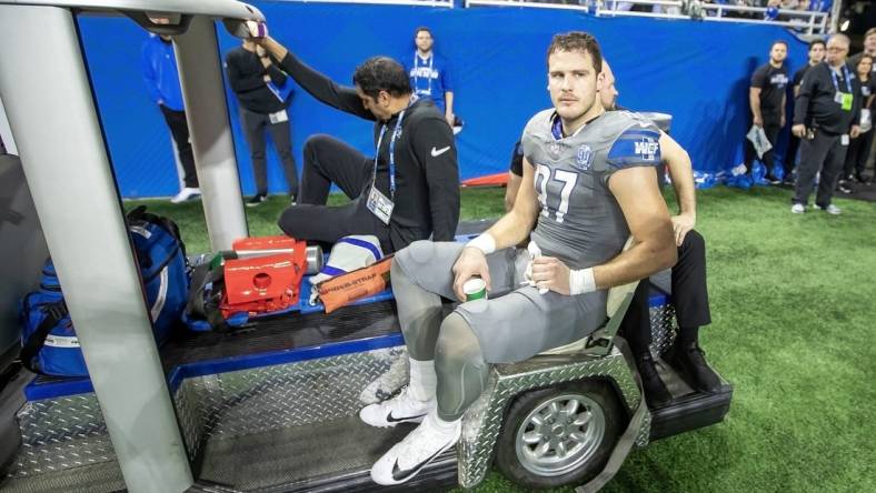 Jan 7, 2024; Detroit, Michigan, USA; Detroit Lions tight end Sam LaPorta (87) is carted off the field after an injury during second quarter of the game against the Minnesota Vikings at Ford Field. Mandatory Credit: David Reginek-USA TODAY Sports