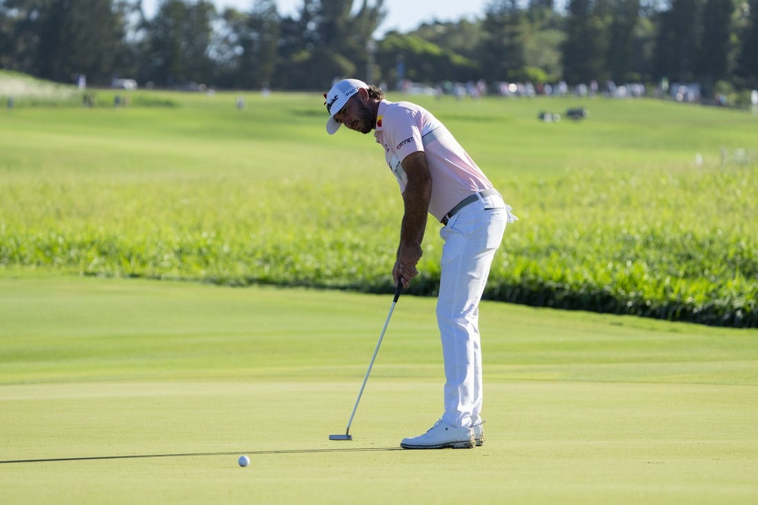 January 7, 2024; Maui, Hawaii, USA; Max Homa putts on the second hole during the final round of The Sentry golf tournament at Kapalua Golf - The Plantation Course. Mandatory Credit: Kyle Terada-USA TODAY Sports