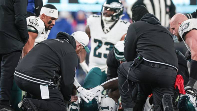 Jan 7, 2024; East Rutherford, New Jersey, USA; Philadelphia Eagles wide receiver A.J. Brown (11) reacts after an injury against the New York Giants during the first quarter at MetLife Stadium. Mandatory Credit: Vincent Carchietta-USA TODAY Sports