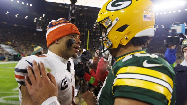 Jan 7, 2024; Green Bay, Wisconsin, USA;  Chicago Bears quarterback Justin Fields (1) greets Green Bay Packers quarterback Jordan Love (10) following the game at Lambeau Field. Mandatory Credit: Jeff Hanisch-USA TODAY Sports