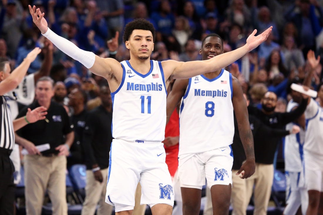 Jan 7, 2024; Memphis, Tennessee, USA; Memphis Tigers guard Jahvon Quinerly (11) reacts after making a three point shot with 3.2 seconds left during the second half against the Southern Methodist Mustangs at FedExForum. Mandatory Credit: Petre Thomas-USA TODAY Sports