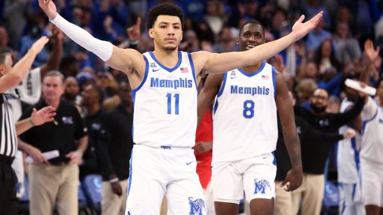 Jan 7, 2024; Memphis, Tennessee, USA; Memphis Tigers guard Jahvon Quinerly (11) reacts after making a three point shot with 3.2 seconds left during the second half against the Southern Methodist Mustangs at FedExForum. Mandatory Credit: Petre Thomas-USA TODAY Sports