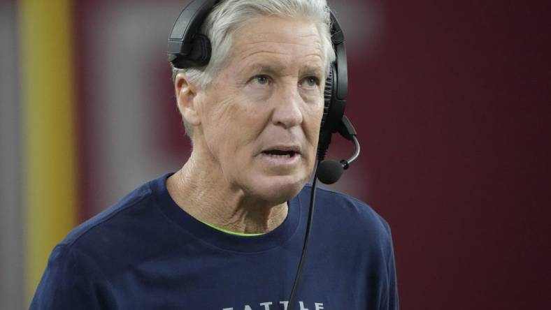 Seattle Seahawks head coach Pete Carroll looks toward the scoreboard during the third quarter against the Arizona Cardinals at State Farm Stadium in Glendale on Jan. 7, 2024.