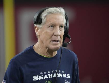 Seattle Seahawks head coach Pete Carroll looks toward the scoreboard during the third quarter against the Arizona Cardinals at State Farm Stadium in Glendale on Jan. 7, 2024.