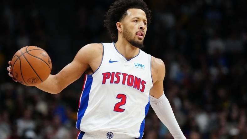 Jan 7, 2024; Denver, Colorado, USA; Detroit Pistons guard Cade Cunningham (2) controls the ball during the first quarter against the Denver Nuggets at Ball Arena. Mandatory Credit: Ron Chenoy-USA TODAY Sports