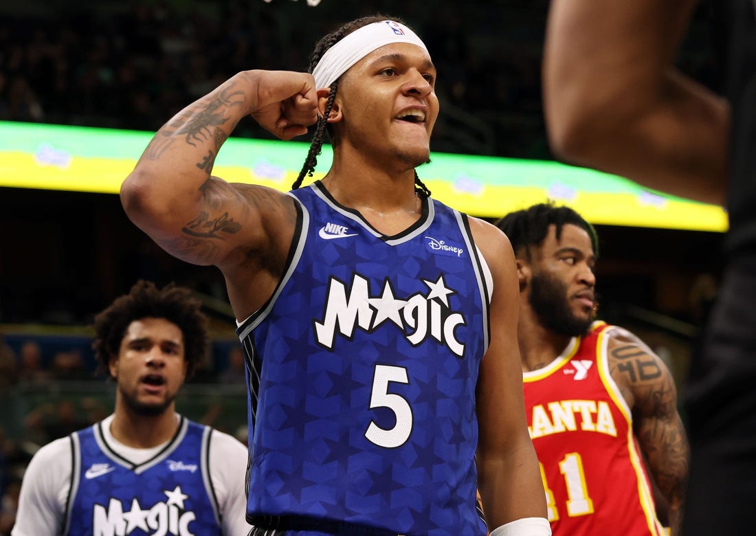 Jan 7, 2024; Orlando, Florida, USA; Orlando Magic forward Paolo Banchero (5) celebrates after he made  basket  against the Atlanta Hawks during overtime at Kia Center. Mandatory Credit: Kim Klement Neitzel-USA TODAY Sports