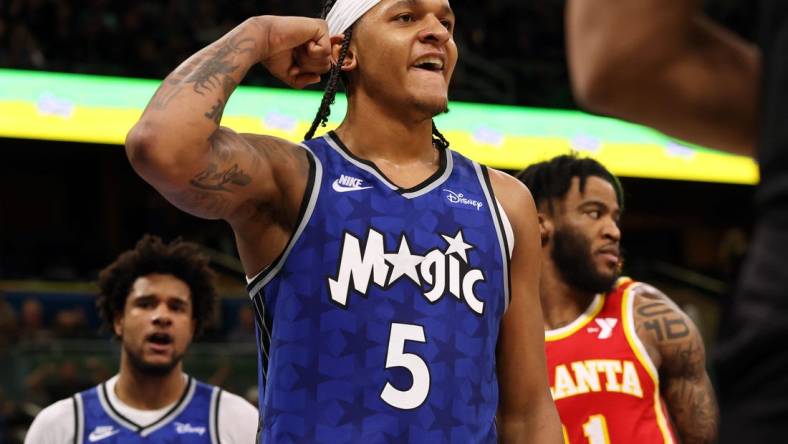 Jan 7, 2024; Orlando, Florida, USA; Orlando Magic forward Paolo Banchero (5) celebrates after he made  basket  against the Atlanta Hawks during overtime at Kia Center. Mandatory Credit: Kim Klement Neitzel-USA TODAY Sports