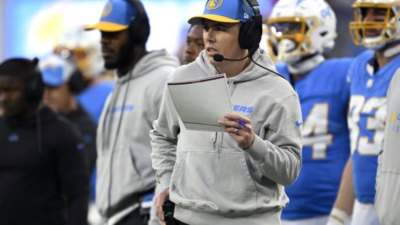 Jan 7, 2024; Inglewood, California, USA; Los Angeles Chargers offensive coordinator Kellen Moore looks on during the second half against the Kansas City Chiefs at SoFi Stadium. Mandatory Credit: Orlando Ramirez-USA TODAY Sports