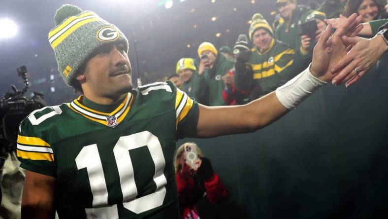 Green Bay Packers quarterback Jordan Love (10) shakes hands with fans following the Packers victory over the Chicago Bears during their football game Sunday, January 7, 2024, at Lambeau Field in Green Bay, Wis. The Packers defeated the Bears 17-9.