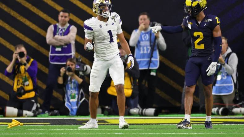 Jan 8, 2024; Houston, TX, USA; Washington Huskies wide receiver Rome Odunze (1) and Michigan Wolverines defensive back Will Johnson (2) react after a flag was thrown during the fourth quarter in the 2024 College Football Playoff national championship game at NRG Stadium. Mandatory Credit: Thomas Shea-USA TODAY Sports