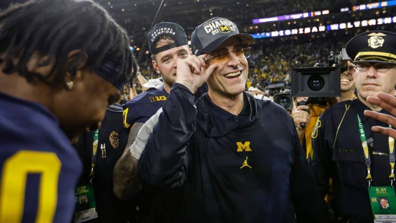 Michigan head coach Jim Harbaugh celebrates after a 34-13 win over Washington to win the national championship at NRG Stadium in Houston on Monday, Jan. 8, 2024.