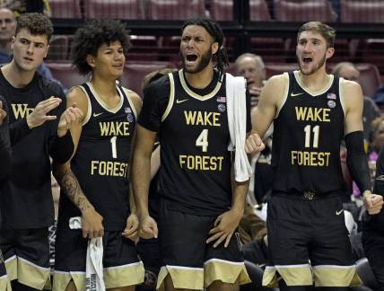 Jan 9, 2024; Tallahassee, Florida, USA; Wake Forest Demon Deacons forwards Marqus Marion (1), Efton Reid III (4), and Andrew Carr (11) react during the second half against the Florida State Seminoles at Donald L. Tucker Center. Mandatory Credit: Melina Myers-USA TODAY Sports