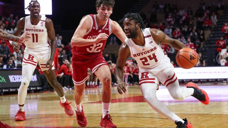 Jan 9, 2024; Piscataway, New Jersey, USA; Rutgers Scarlet Knights guard Austin Williams (24) dribbles against Indiana Hoosiers guard Trey Galloway (32) during the second half at Jersey Mike's Arena. Mandatory Credit: Vincent Carchietta-USA TODAY Sports