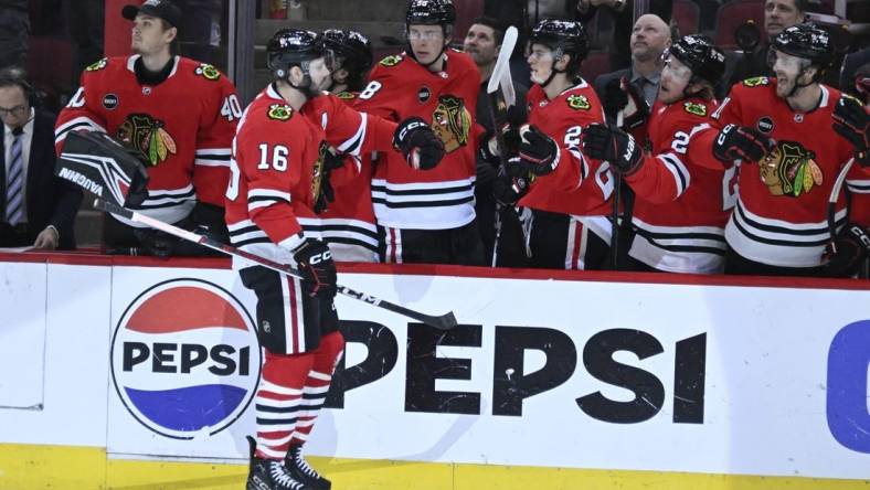 Jan 9, 2024; Chicago, Illinois, USA;  Chicago Blackhawks center Jason Dickinson (16) celebrates with teammates after he scores against the Edmonton Oilers during the first period at the United Center. Mandatory Credit: Matt Marton-USA TODAY Sports