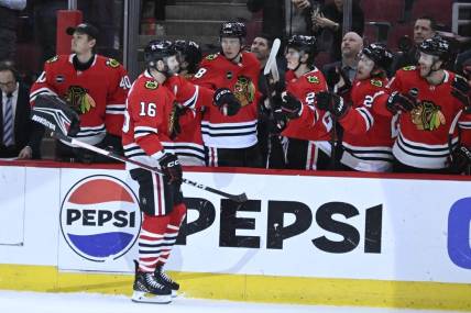 Jan 9, 2024; Chicago, Illinois, USA;  Chicago Blackhawks center Jason Dickinson (16) celebrates with teammates after he scores against the Edmonton Oilers during the first period at the United Center. Mandatory Credit: Matt Marton-USA TODAY Sports
