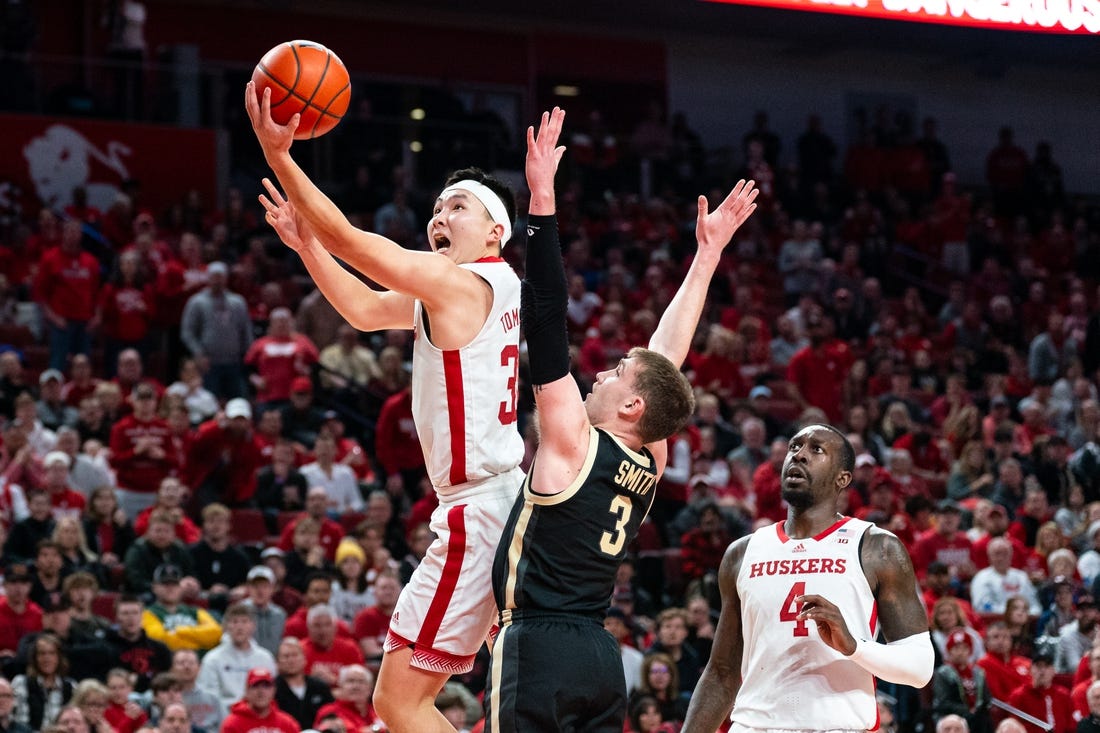 Jan 9, 2024; Lincoln, Nebraska, USA; Nebraska Cornhuskers guard Keisei Tominaga (30) shoots the ball against Purdue Boilermakers guard Braden Smith (3) during the first half at Pinnacle Bank Arena. Mandatory Credit: Dylan Widger-USA TODAY Sports