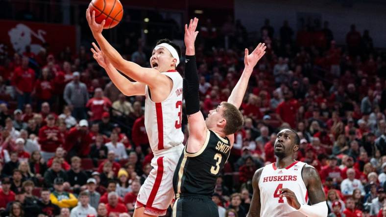 Jan 9, 2024; Lincoln, Nebraska, USA; Nebraska Cornhuskers guard Keisei Tominaga (30) shoots the ball against Purdue Boilermakers guard Braden Smith (3) during the first half at Pinnacle Bank Arena. Mandatory Credit: Dylan Widger-USA TODAY Sports