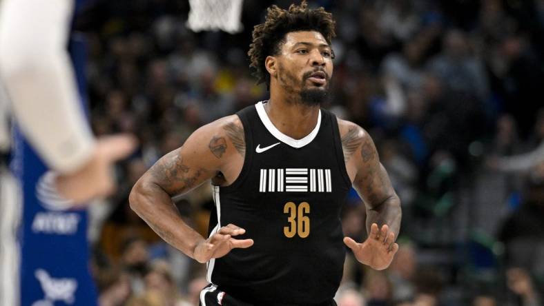 Jan 9, 2024; Dallas, Texas, USA; Memphis Grizzlies guard Marcus Smart (36) celebrates after he makes a three point shot against the Dallas Mavericks during the second half at the American Airlines Center. Mandatory Credit: Jerome Miron-USA TODAY Sports