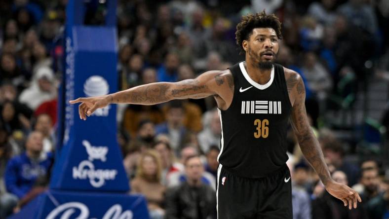 Jan 9, 2024; Dallas, Texas, USA; Memphis Grizzlies guard Marcus Smart (36) celebrates after he makes a three point shot against the Dallas Mavericks during the second half at the American Airlines Center. Mandatory Credit: Jerome Miron-USA TODAY Sports