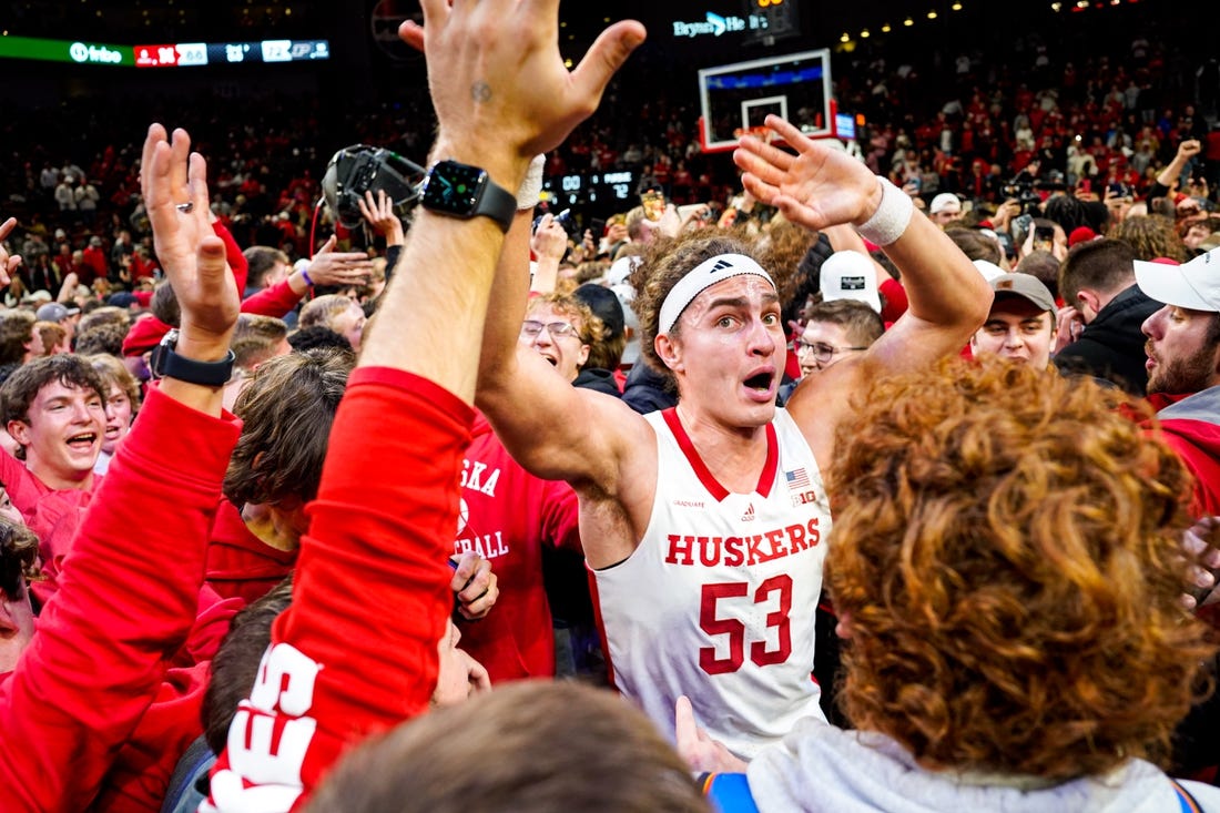 Jan 9, 2024; Lincoln, Nebraska, USA; The Nebraska Cornhuskers celebrate after defeating the Purdue Boilermakers at Pinnacle Bank Arena. Mandatory Credit: Dylan Widger-USA TODAY Sports