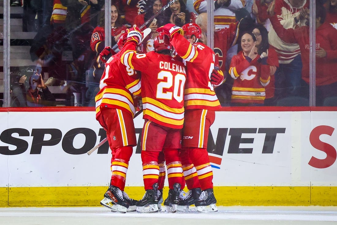 Jan 9, 2024; Calgary, Alberta, CAN; Calgary Flames center Blake Coleman (20) celebrates his goal with teammates against the Ottawa Senators during the third period at Scotiabank Saddledome. Mandatory Credit: Sergei Belski-USA TODAY Sports