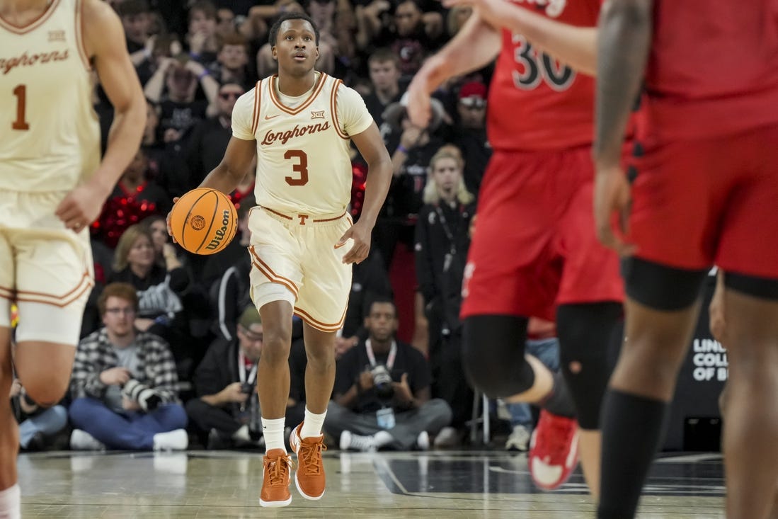 Jan 9, 2024; Cincinnati, Ohio, USA;  Texas Longhorns guard Max Abmas (3) dribbles the ball against the Cincinnati Bearcats in the second half at Fifth Third Arena. Mandatory Credit: Aaron Doster-USA TODAY Sports