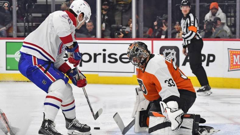 Jan 10, 2024; Philadelphia, Pennsylvania, USA; Philadelphia Flyers goaltender Samuel Ersson (33) makes a save against Montreal Canadiens left wing Juraj Slafkovsky (20) during the second period at Wells Fargo Center. Mandatory Credit: Eric Hartline-USA TODAY Sports