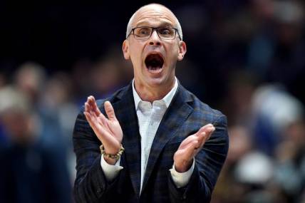 Connecticut Huskies head coach Dan Hurley encourages the team in the first half of a college basketball game between the Connecticut Huskies and the Xavier Musketeers, Wednesday, Jan. 10, 2024, at Cintas Cetner in Cincinnati.