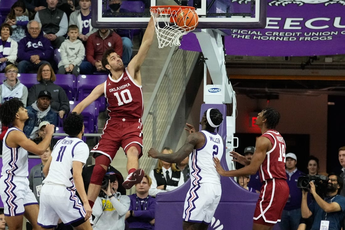 Jan 10, 2024; Fort Worth, Texas, USA; Oklahoma Sooners forward Sam Godwin (10) dunks the ball past TCU Horned Frogs guard Trevian Tennyson (11) during the first half at Ed and Rae Schollmaier Arena. Mandatory Credit: Chris Jones-USA TODAY Sports