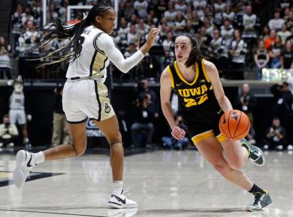 Iowa Hawkeyes guard Caitlin Clark (22) shakes Purdue's Jayla Smith at sold out Mackey Arena on Wednesday, Jan. 10.