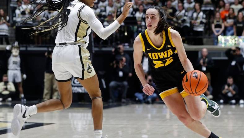 Iowa Hawkeyes guard Caitlin Clark (22) shakes Purdue's Jayla Smith at sold out Mackey Arena on Wednesday, Jan. 10.