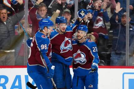 Jan 10, 2024; Denver, Colorado, USA; Colorado Avalanche right wing Valeri Nichushkin (13) celebrates his goal with right wing Mikko Rantanen (96) and left wing Jonathan Drouin (27) in the second period against the Vegas Golden Knights at Ball Arena. Mandatory Credit: Ron Chenoy-USA TODAY Sports