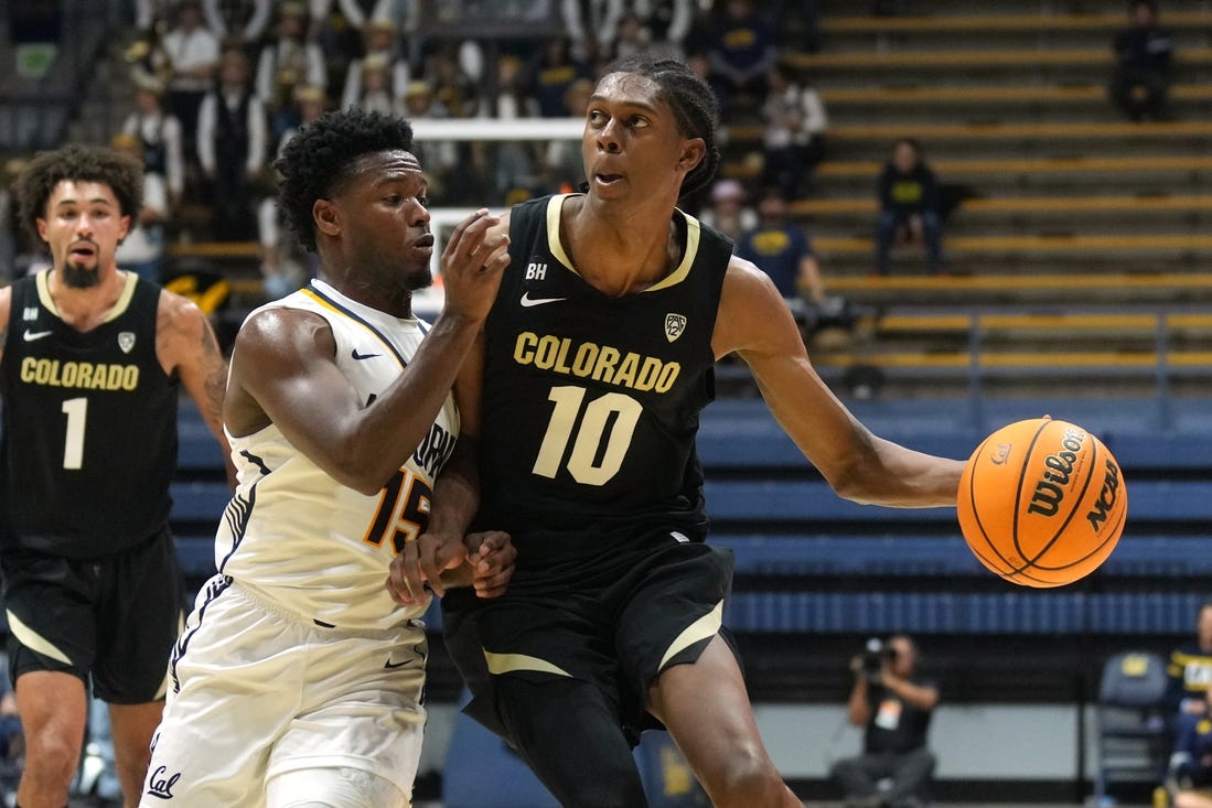 Jan 10, 2024; Berkeley, California, USA; Colorado Buffaloes forward Cody Williams (10) dribbles against California Golden Bears guard Jalen Cone (15) during the first half at Haas Pavilion. Mandatory Credit: Darren Yamashita-USA TODAY Sports