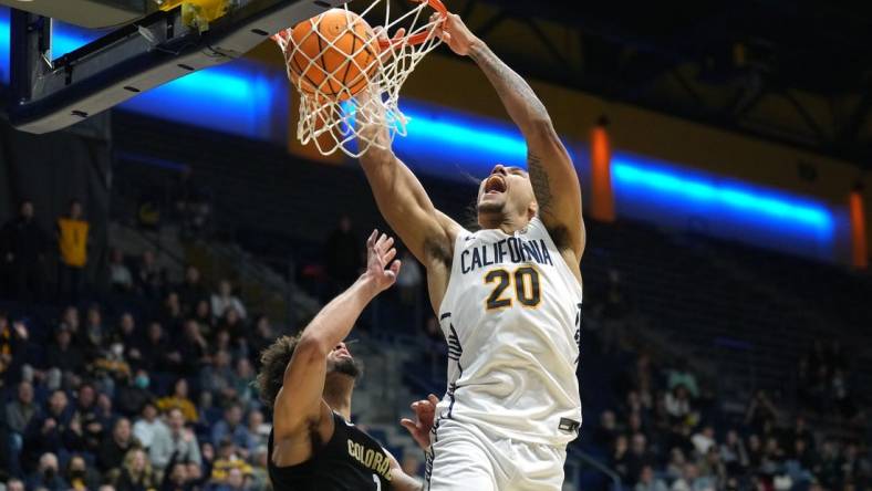 Jan 10, 2024; Berkeley, California, USA; California Golden Bears guard Jaylon Tyson (20) dunks against Colorado Buffaloes guard J'Vonne Hadley (1) during the second half at Haas Pavilion. Mandatory Credit: Darren Yamashita-USA TODAY Sports