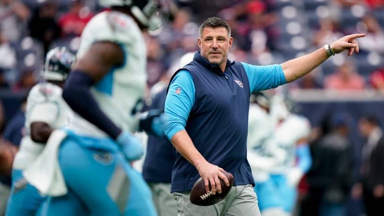 Tennessee Titans Head Coach Mike Vrabel runs his team through warmups before their game against the Houston Texans at NRG Stadium in Houston, Texas., Sunday, Dec. 31, 2023. Vrabel was fired by owner Amy Adams Strunk Monday after having two losing seasons back-to-back.