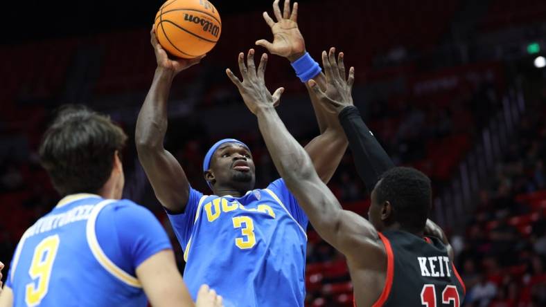 Jan 11, 2024; Salt Lake City, Utah, USA; UCLA Bruins forward Adem Bona (3) goes to the basket against Utah Utes center Keba Keita (13) during the first half at Jon M. Huntsman Center. Mandatory Credit: Rob Gray-USA TODAY Sports