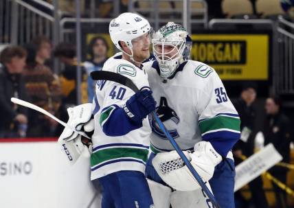 Jan 11, 2024; Pittsburgh, Pennsylvania, USA; Vancouver Canucks center Elias Pettersson (40) and goaltender Thatcher Demko (35) celebrate after defeating the Pittsburgh Penguins in overtime at PPG Paints Arena. The Canucks won 4-3 in overtime. Mandatory Credit: Charles LeClaire-USA TODAY Sports