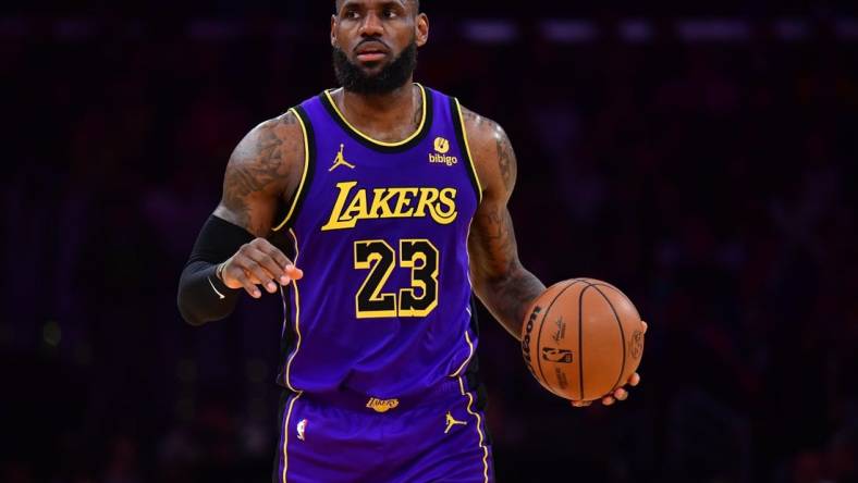 Jan 11, 2024; Los Angeles, California, USA; Los Angeles Lakers forward LeBron James (23) controls the ball against the Phoenix Suns during the second half at Crypto.com Arena. Mandatory Credit: Gary A. Vasquez-USA TODAY Sports