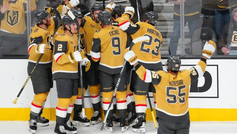 Jan 11, 2024; Las Vegas, Nevada, USA; Vegas Golden Knights players celebrate after Vegas Golden Knights defenseman Alex Pietrangelo (7) scored a goal against the Boston Bruins in overtime to give the Golden Knights a 2-1 victory at T-Mobile Arena. Mandatory Credit: Stephen R. Sylvanie-USA TODAY Sports