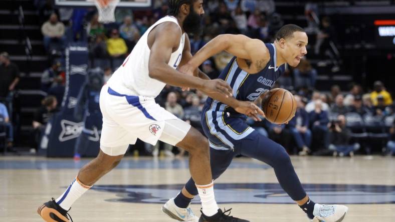 Jan 12, 2024; Memphis, Tennessee, USA; Memphis Grizzlies guard Desmond Bane (22) drives to the basket as Los Angeles Clippers guard James Harden (1) defends during the first half at FedExForum. Mandatory Credit: Petre Thomas-USA TODAY Sports