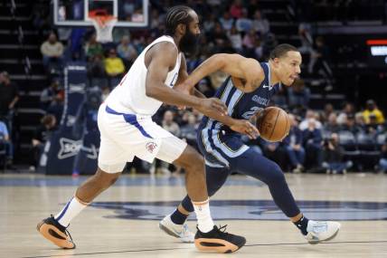 Jan 12, 2024; Memphis, Tennessee, USA; Memphis Grizzlies guard Desmond Bane (22) drives to the basket as Los Angeles Clippers guard James Harden (1) defends during the first half at FedExForum. Mandatory Credit: Petre Thomas-USA TODAY Sports